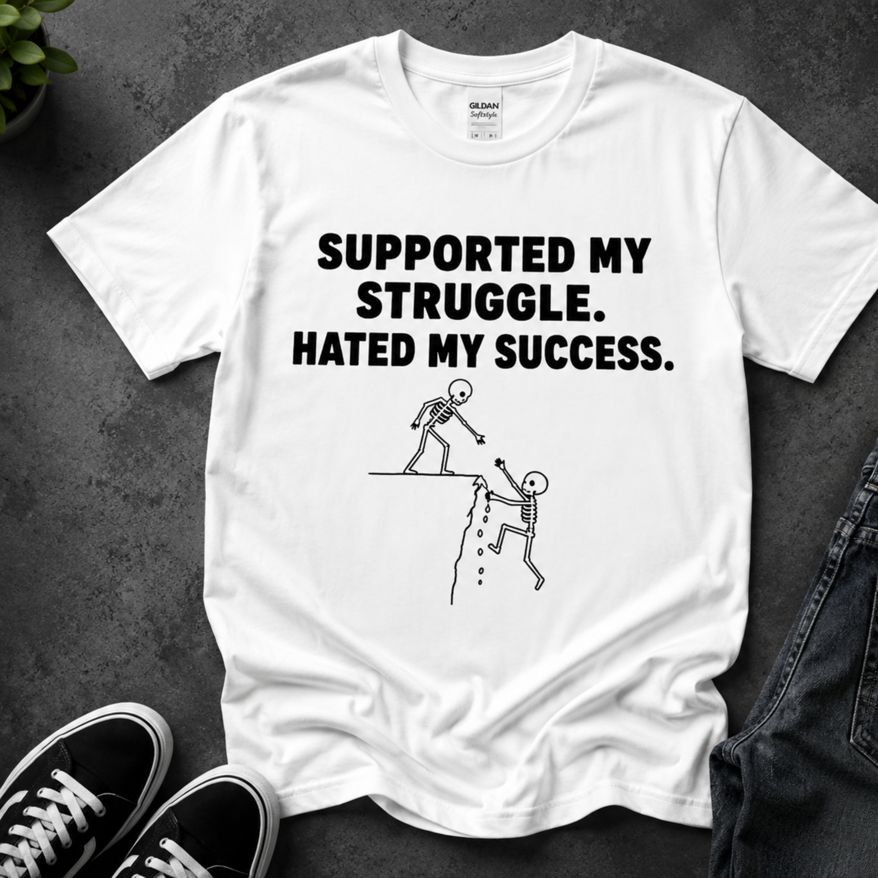 supported my struggle hated my success white motivational quote t-shirt mockup flat lay unisex graphic tee